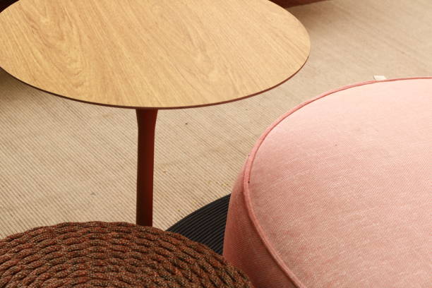 istock Cozy Raffia Puff, Pink Puff and Wooden Table 1865803368