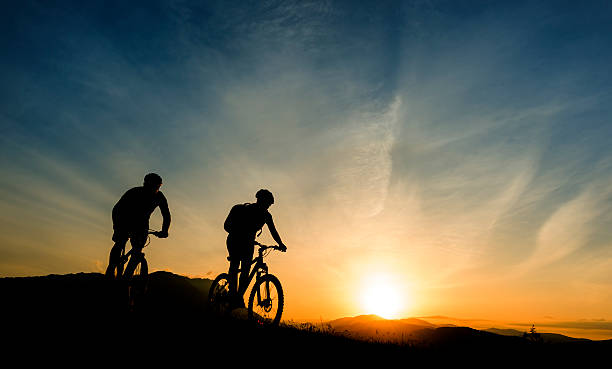 istock mountain bike at sunset 186581124