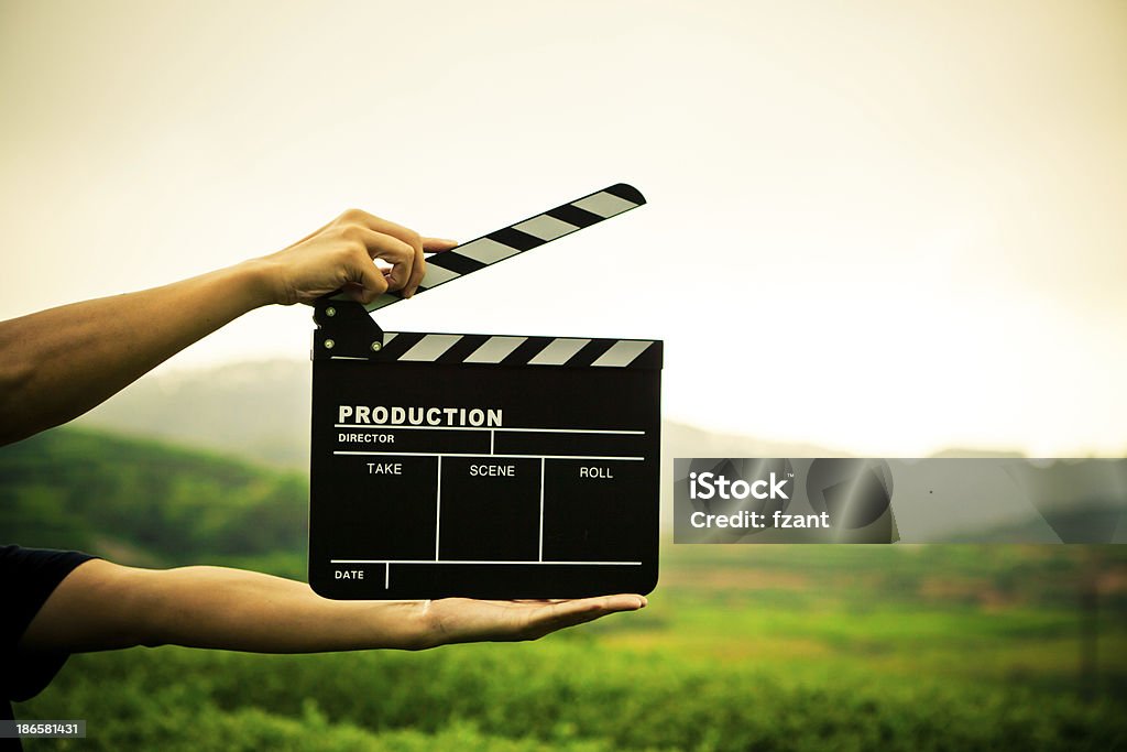 clapper board with hand Movie Stock Photo