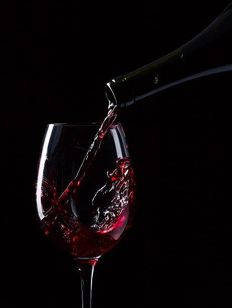 istock bottle and glass with red wine 186581627