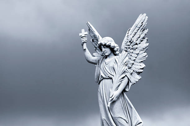 istock Angel, white marble statue against dark background, copy space 186581716