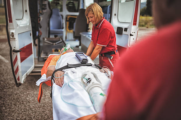 istock paramedics bring the stretcher inside ambulance 186582047
