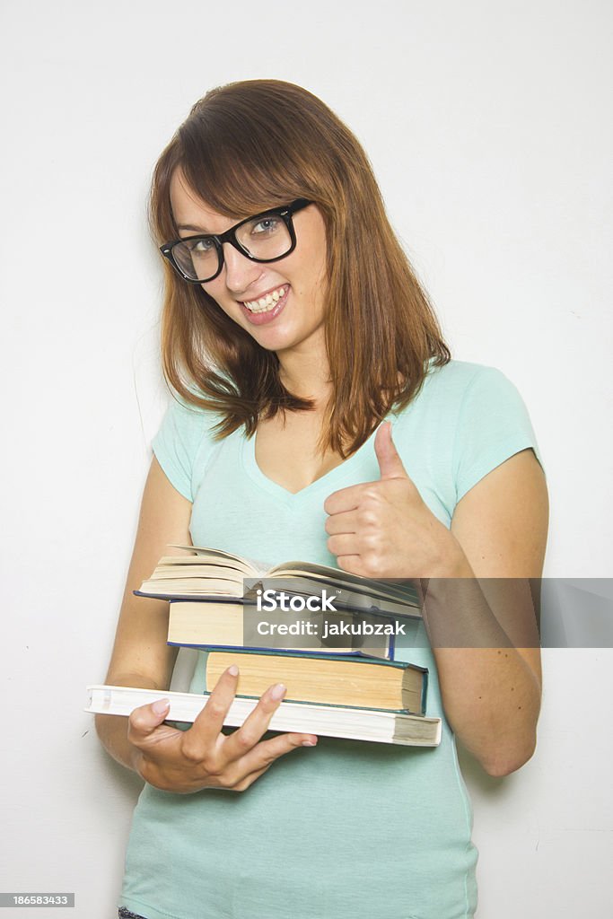 Jovem aluna com livros em branco. - Foto de stock de Adulto royalty-free