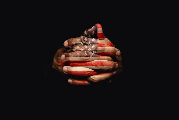 istock Crossed hands with USA flag 186585123