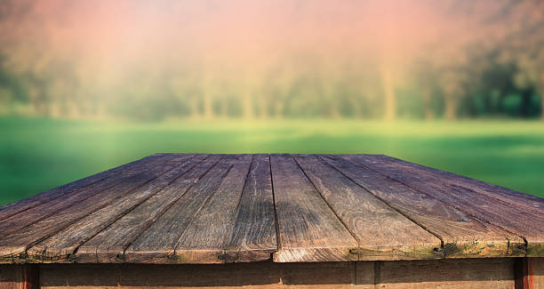 istock top view of old wood table with blurry background 186585223