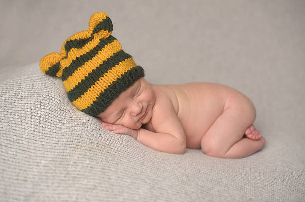 istock Smiling Newborn Boy in Knit Hat 186586816