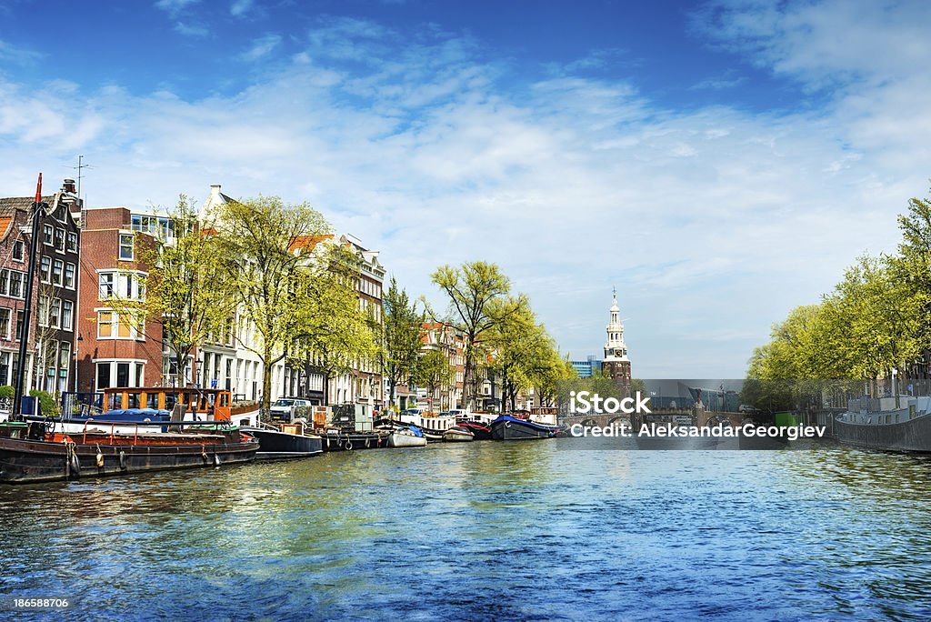 Canale di Amsterdam, Munttoren a Centrum (tower) - Foto stock royalty-free di Acqua