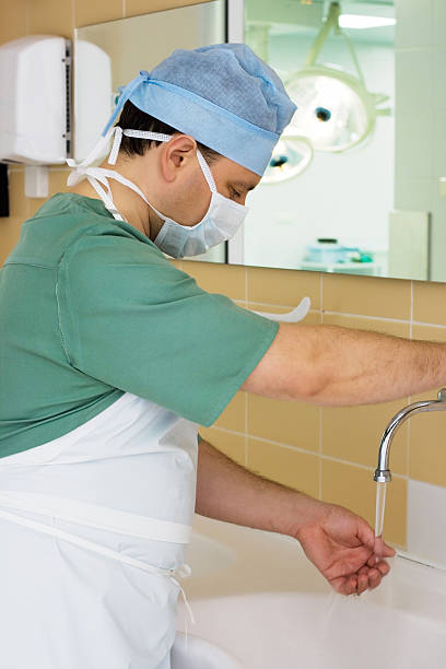 istock Surgeon Washing his Hands in Operating Room 186588771