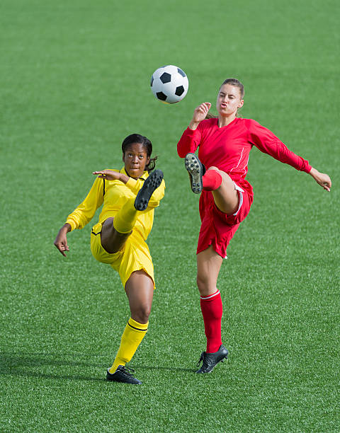 istock Young Women Playing Football 186589328