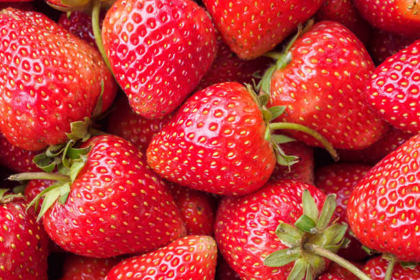 istock Fresh organic red strawberry fruit background 1865899761