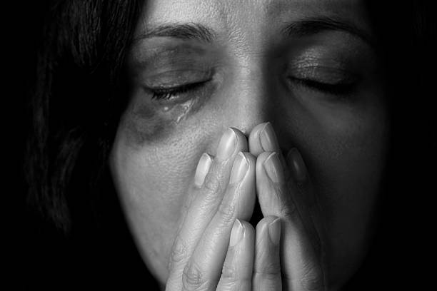 Dramatic portrait of female victim of domestic violence Domestic violence victim, a young woman being hurt  torture photos stock pictures, royalty-free photos & images
