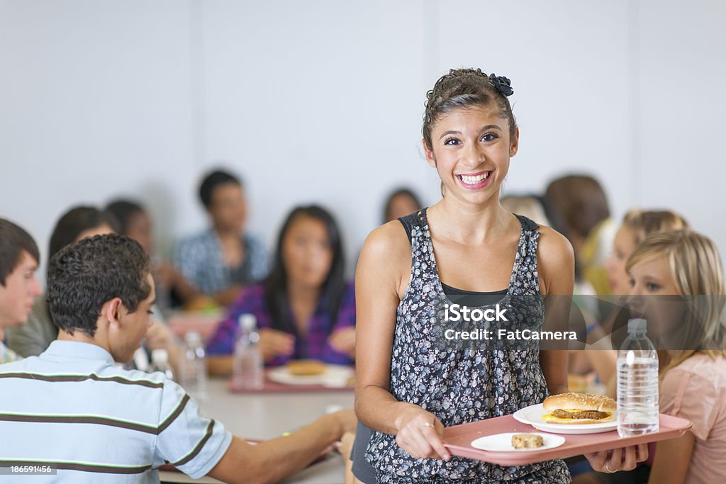 High School Cafeteria Diverse high school students eating lunch in the cafeteria Cafeteria Stock Photo