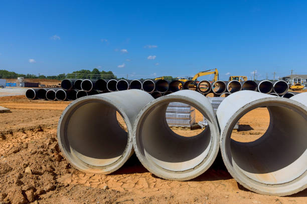 istock Concrete drainage sewage storm water pipes are stacked at construction site in preparation 1865915568