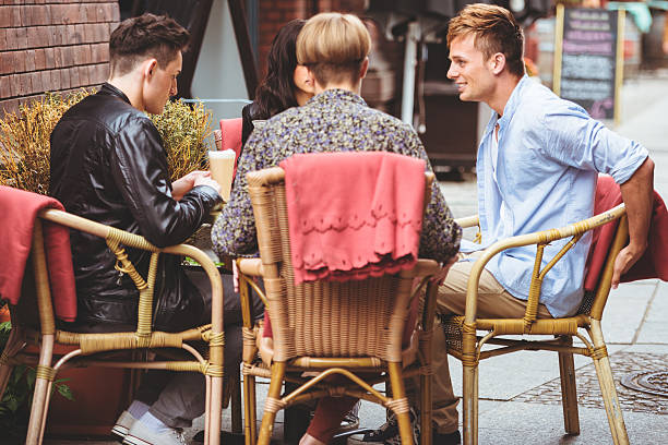 istock friends have a breakfast outdoors 186591802