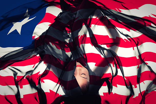 istock Young girl with Liberian Flag 186591862