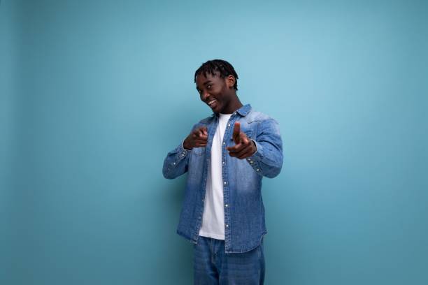 istock confident african young man with dreadlocks in casual denim jacket 1865918805