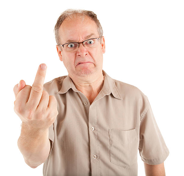 Grumpy Man Giving the Middle Finger Man displeased about something is showing the middle finger. derange stock pictures, royalty-free photos & images