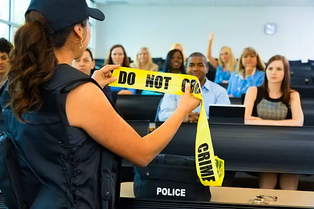 Photo of Law:  Policewoman speaks to police cadets.