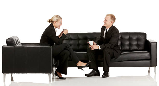 istock Business couple sitting on couch 186594187