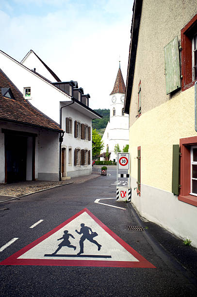 School children crossing road sign