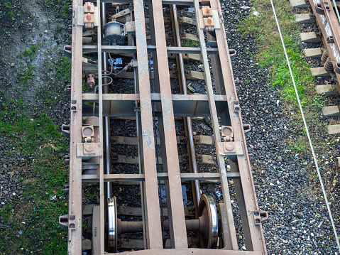 Empty freight train cars. Cars without a roof. Freight transportation. Freight train cars in the parking lot. Platforms