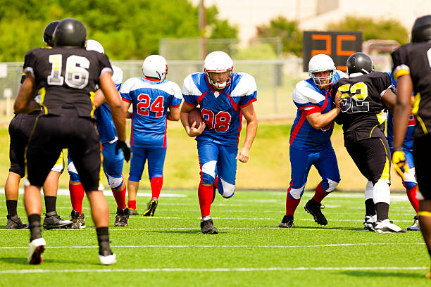 istock Sports:  Football running back makes a play. 186596255