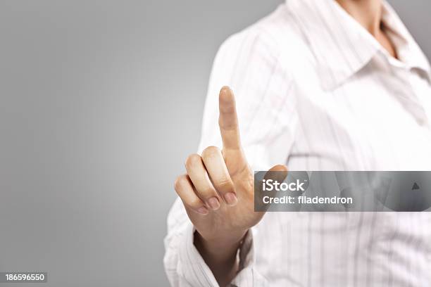 Businesswoman Pressing Button On Touch Screen Stock Photo - Download Image Now - Adult, Adults Only, Advertisement