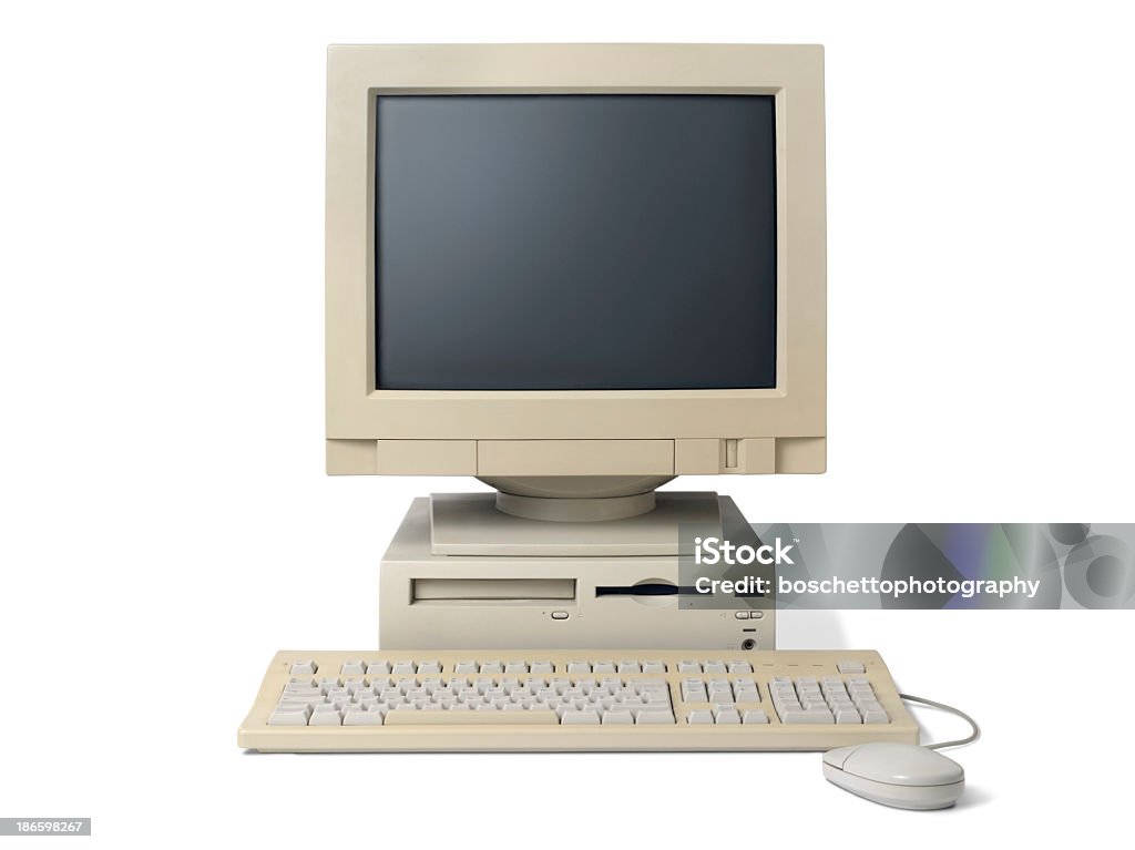 Old, white, desktop PC computer with a keyboard and mouse Retro computer isolated on white. Clipping path included for easy change background. Computer Stock Photo