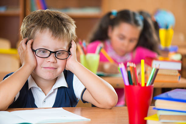 istock Schoolchildren in classroom at school 186598389
