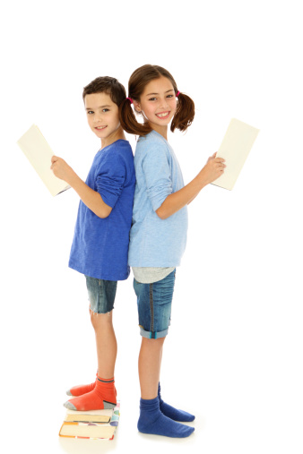 Two cute girls with happy faces posing in a studio with white background