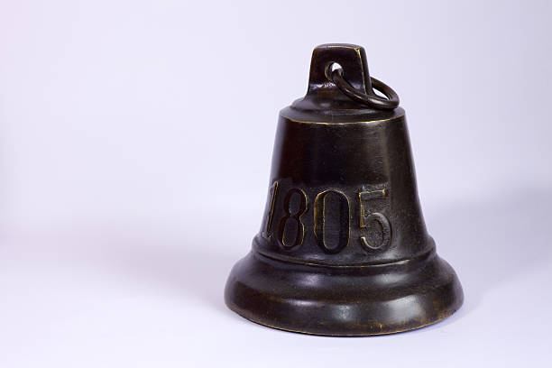 Traditional Classic dinner bell on porch near big red barn, copy space, no people, background image for announcements, meals, dinners, posters