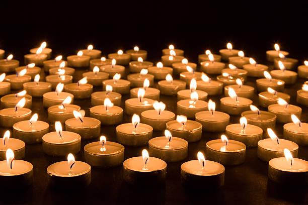 istock Large group of burning candles at a black background 186598982