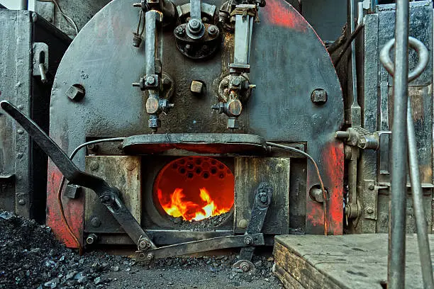 Steam locomotive with boiler and firehole door, Darjeeling, West Bengal, India.