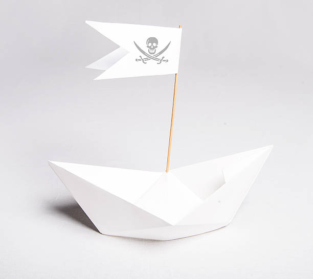 istock Pirate Paper boat with flag 186599173