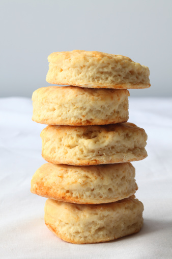 Stack of Buttermilk Biscuits on white background.