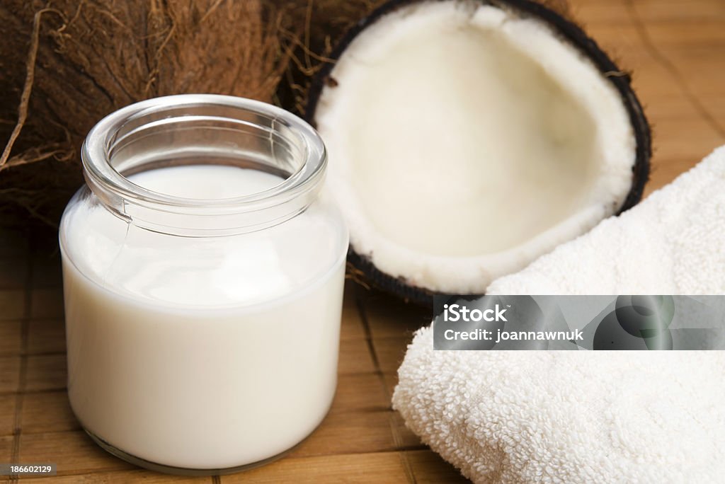 coconut milk coconut fruit with a jar filled with milk Coconut Stock Photo