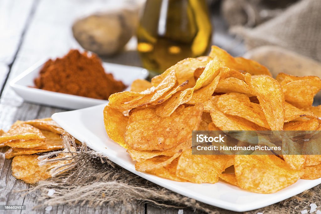 Potato Chips with fresh ingredients Potato Chips with portion of sunfloweroil and paprika powder Appetizer Stock Photo