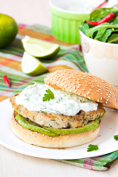Fresh, delicious chicken burger in the Greek style with zucchini stock photo