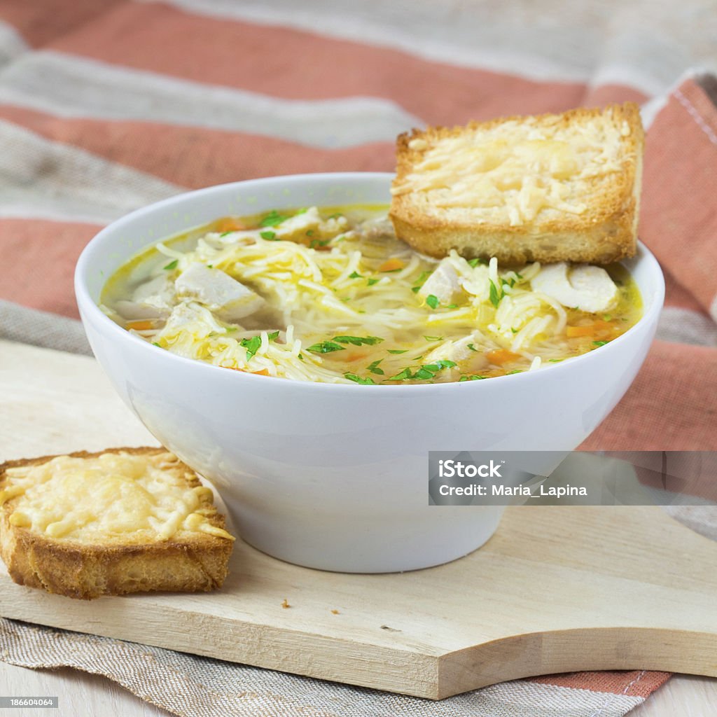 Chicken soup with noodles, carrots and cheese croutons Appetizer Stock Photo