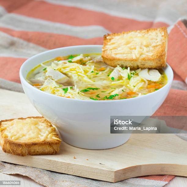 Chicken Soup With Noodles Carrots And Cheese Croutons Stock Photo - Download Image Now