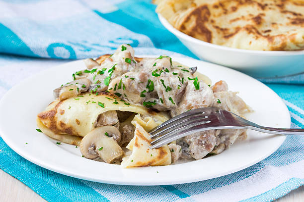 istock Russian pancakes with chicken and mushrooms champignon 186604191