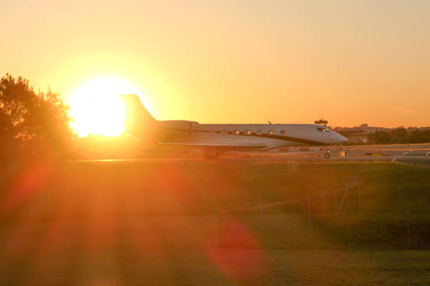 The Gulfstream G600 plane of Gina Rinehart, registration N920BM, taxiing after landing at Sydney Kingsford-Smith Airport. This image was taken from Shep's Mound, Ross Smith Avenue, Mascot, on a hot and sunny evening at sunset on 14 December 2023.