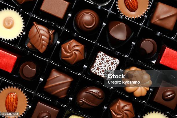 Closeup Shot Of Many Chocolates In Box Stock Photo - Download Image Now - Anniversary, Backgrounds, Brown