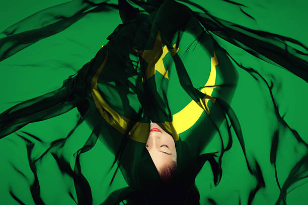 Beautiful woman laying in Mauritanian flag