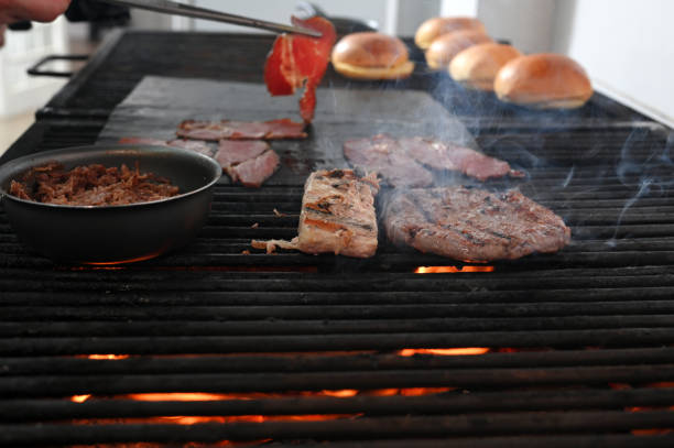 istock meat roasting on a charcoal barbecue lit wood with fire for roasting pork pancetta on the grill 1866092399