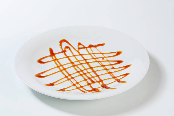 istock Porcelain plate ornated with caramel sauce 186610710