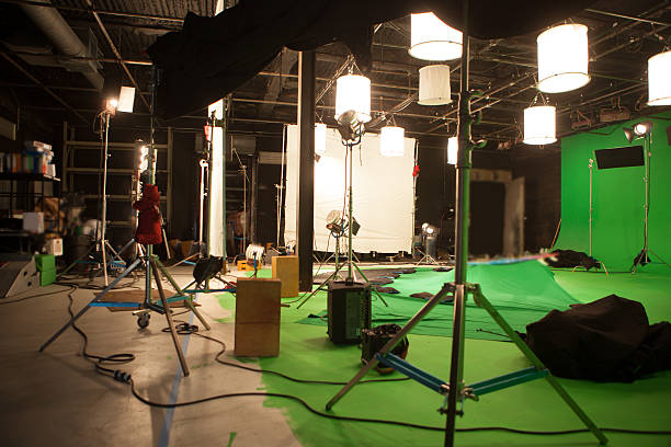 Greenscreen Studio Shooting on a greenscreen cyc wall. film studio stock pictures, royalty-free photos & images
