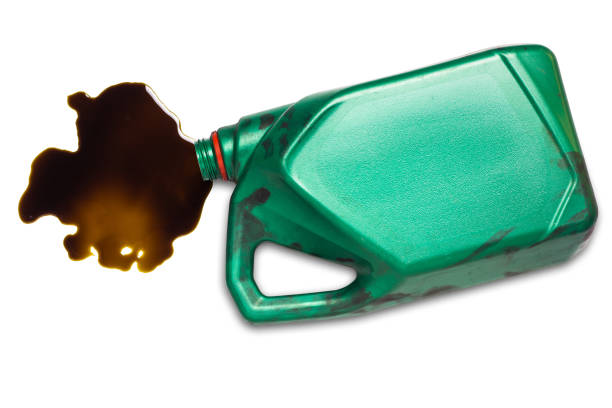 old engine oil bottle old black lubricant Spilled used car engine on white background