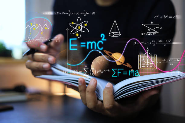 physics and mathematics physics and mathematics equation concept with student writing on a notebook about Albert Einstein's calculations of the equations of relativity and Sir Isaac Newton's theory of gravity on note book stem topic stock pictures, royalty-free photos & images
