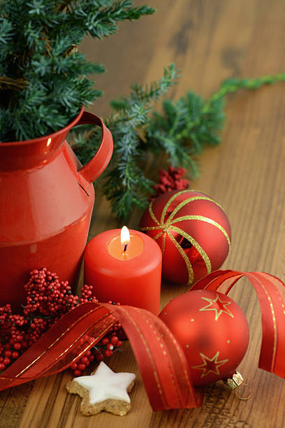 istock Candle next to Christmas tree balls and pine green 186613186